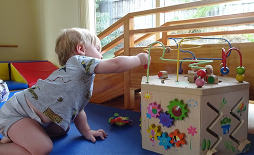 Photo of a child using materials to cultivate their creativity.