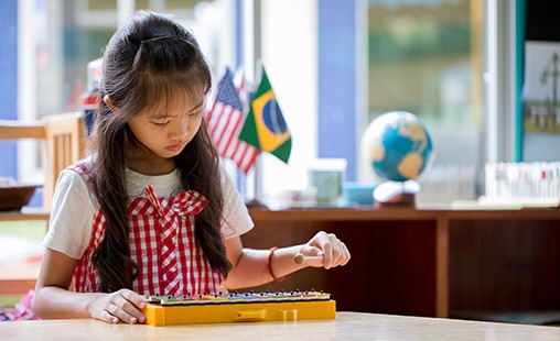 Photo of a student practicing on the xylophone.